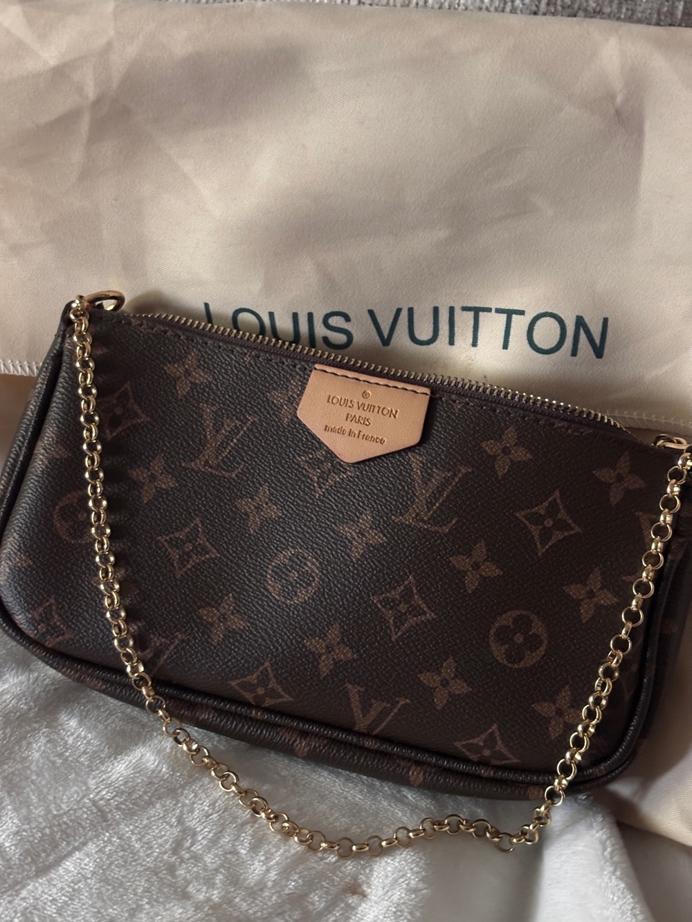 LV Monogram Mini Pochette in Brown with Gold Chain no offers price firm.